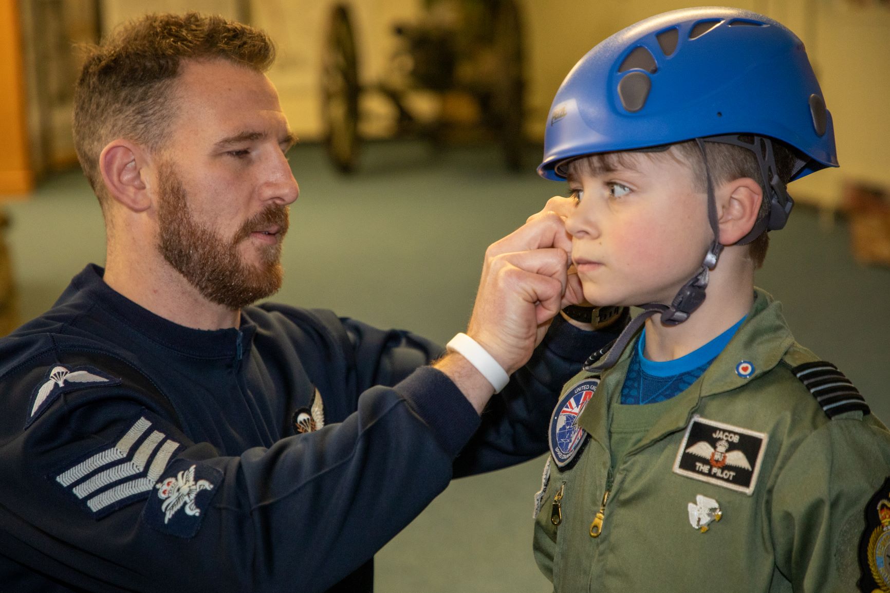 Jacob has his hat tightened by personnel
